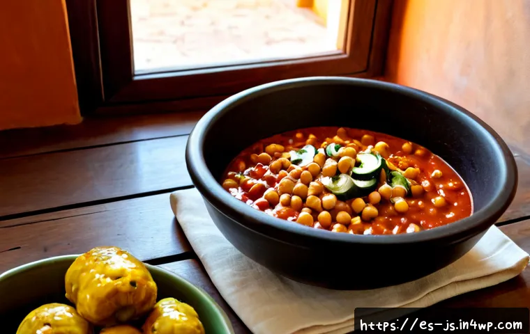 Home 17 대체육으로 만든 고추장 찜 요리법 - Photorealistic Spanish home kitchen scene, a rustic terracotta cazuela filled with glossy plant-base...